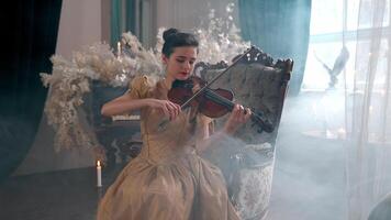 A woman in a dress playing the violin video