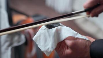 A person is holding a stick and wiping it with a cloth video
