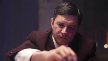 A man in a suit is playing a game of chess video