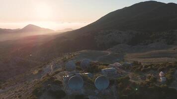 An aerial view of a mountain with several antennas video