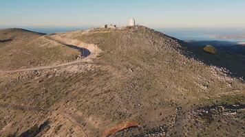 A view of the top of a mountain with a lighthouse video