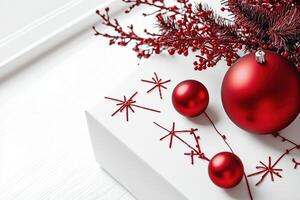 A Festive Christmas Scene with Red Ornaments and Twigs on a White Background photo