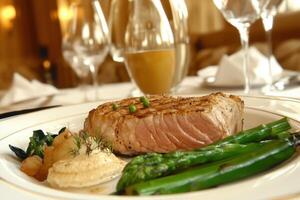 A Seared Tuna Steak with Asparagus and Potato Puree, A Gourmet Dinner Delicacy photo