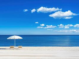 A Serene Beachscape Lounge Chairs Under a White Umbrella Inviting Relaxation photo
