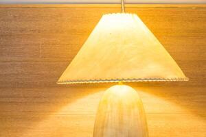 A lamp sitting on a table next to a lamp photo
