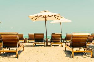 Beach chairs and umbrellas on the beach photo