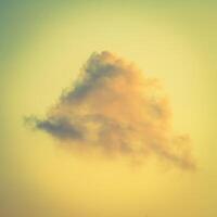 A plane flying in the sky with a cloud in the background photo