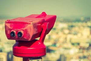 A red traffic light on top of a building photo