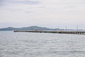 Concrete Bridge simple fishing port that stretches along out from the coast out to sea. photo