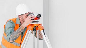 engineer male builder surveyor team using laser leveling measure equipment tool professional working photo