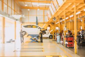 Garage car service center mechanic team worker working fix maintenance vehicle blur for background photo