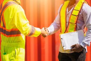 Worker hand shaking together. Engineer team join deal projects cooperated handshake in logistics industry photo