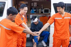 paramedic mobile car medical emergency team success save people life at accident site happy teamwork together photo
