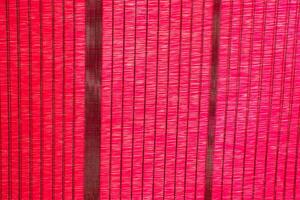Red color sun shade net bugs pests protecting prevent agriculture farm plant field photo