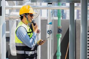 engineer man working with water pipe line in gas oil industry workplace photo