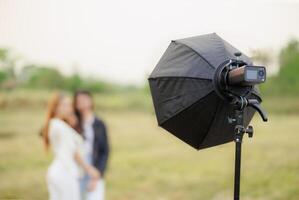 portable flash light setup with reflector modifier for portrait lighting outdoor photography photo
