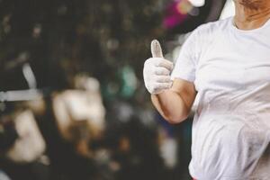 mechanic hand thumbs up for finish check service car in garage auto workshop good healthy engine with space for text photo