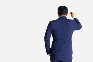 Man in formal suit model acting writing whiteboard view form back isolated on white background. photo