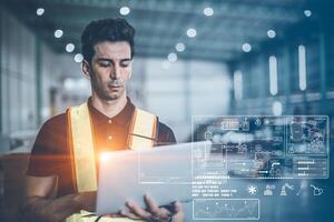 Engineer working with laptop computer for modern digital computing technology for advance engineering factory operation information data concept photo