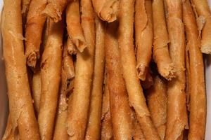 a close up of a box of fried cheese sticks photo
