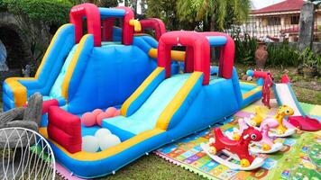 a large inflatable slide with a small inflatable slide photo