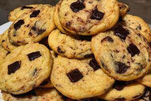 a pile of chocolate chip cookies on a plate photo