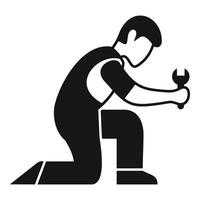 Repairman kneeling and holding a wrench, fixing or installing something vector