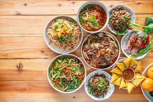 A variety of Tai Yai food is served on the table inside the restaurant and Tai Yai food is considered healthy because most of the ingredients are from beans and vegetables it is not heavily seasoned. photo