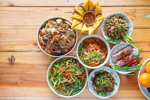A variety of Tai Yai food is served on the table inside the restaurant and Tai Yai food is considered healthy because most of the ingredients are from beans and vegetables it is not heavily seasoned. photo