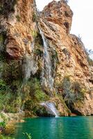 Spain, Valencia, March 29, 2024. Waterfall in Valencia in spring, rock climbing photo
