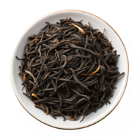 Dried black tea leaves in a white bowl on display png