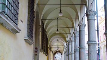 Ancient building with arches and lamps hanging from ceiling video