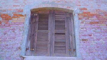 Window closed with shutters on abandoned building in Burano video
