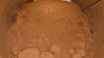 Bitter instant coffee powder with lumps in tin on table video