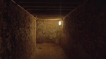 Ancient Venetian passageway with single illuminating lamp video