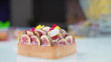 Light brown squared biscuit decorated with fig slices video