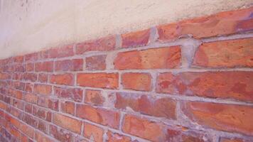 Lower part of house wall cladding with brick in Burano video