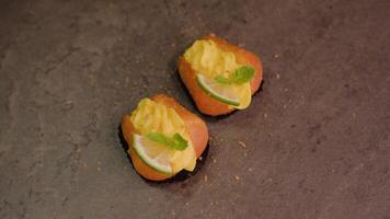 Cakes decorated with custard lime and mint lie on table video