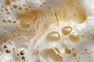 Closeup of beer bubbles forming a smooth surface photo