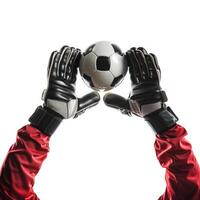Goalkeeper wearing red uniform catching soccer ball with both hands photo