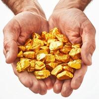 Man holding pile of gold nuggets in open hands photo