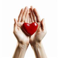 Man cupping red heart in open hands showing love photo