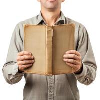 Man holding open old book on white background photo