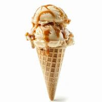 Delicious caramel sauce dripping on ice cream scoops in waffle cone photo