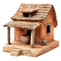 Clay model of a traditional hut with thatched roof displaying rural architecture photo