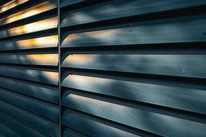 Modern building facade showing metal louvers reflecting sunlight photo