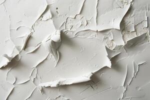 White painted wall cracking showing texture and layers photo