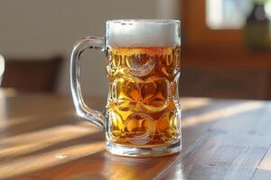 Large glass of beer with foam is standing on wooden table in pub photo