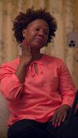 A Woman Dressed in a Pink Blouse Expressing Various Emotions in a Thoughtful Manner video
