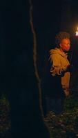 An Enigmatic and Mystical Night in the Lush Green Forest Accompanied by a Torchbearer video